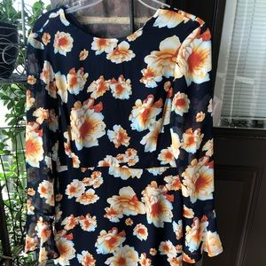 Beautiful sexy dress with flowers. Long sleeves.